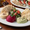 Hummus Trio (Edamame, Garbanzo, Beets): Blended with chopped garlic, olive oil, & freshly squeezed lime juice