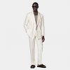 Off-White Tailored Fit Havana Suit: Craft a distinguished presence in this off-white double-breasted Havana suit, featuring a natural shoulder for a relaxed demeaner, a slightly curved peak lapel, and jetted pockets for streamlined elegance.